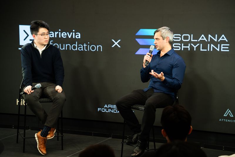 Ryan Zhang in conversation with a guest speaker at the February 13, 2026 program